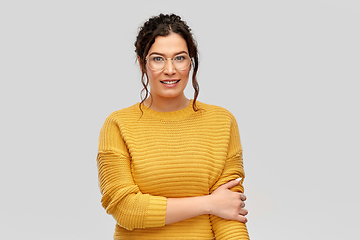 Image showing happy smiling young woman in glasses