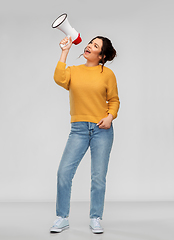 Image showing young woman speaking to megaphone