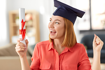 Image showing student woman with laptop and diploma at home