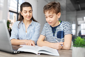 Image showing mother and son doing homework together