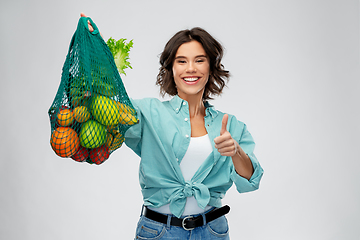 Image showing happy smiling woman with food in reusable net bag