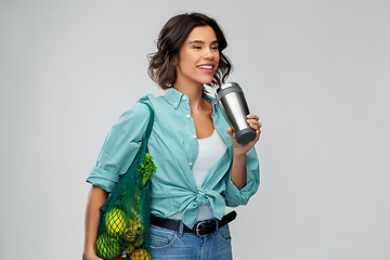 Image showing happy smiling woman with food in reusable net bag