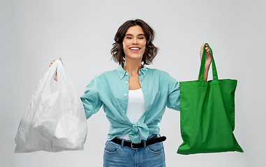 Image showing woman with plastic and reusable shopping bag