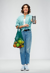 Image showing happy smiling woman with food in reusable net bag