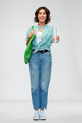 Image showing woman with bag for food shopping and glass bottle