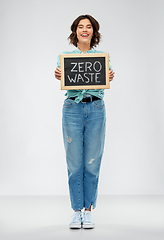 Image showing happy woman with chalkboard with zero waste words