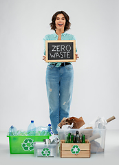 Image showing happy woman sorting paper, metal and plastic waste