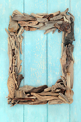 Image showing Abstract Driftwood Frame on Rustic Blue Wood