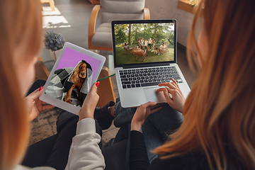 Image showing Young friends, women using gadgets to watch cinema, photos, online courses, taking selfie or vlog