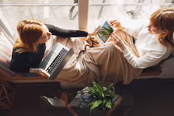 Image showing Young friends, women using gadgets to watch cinema, photos, online courses, taking selfie or vlog