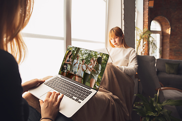 Image showing Young friends, women using gadgets to watch cinema, photos, online courses, taking selfie or vlog