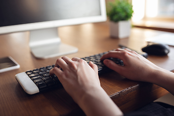 Image showing Caucasian young woman in business attire working in office