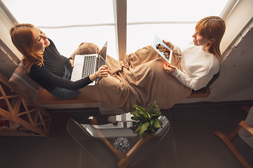 Image showing Young friends, women using gadgets to watch cinema, photos, online courses, taking selfie or vlog