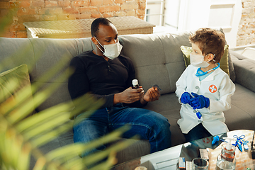 Image showing Little caucasian boy as a doctor consulting for patient, working in cabinet, close up