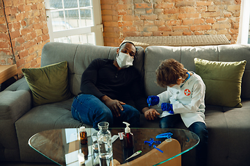 Image showing Little caucasian boy as a doctor consulting for patient, working in cabinet, close up