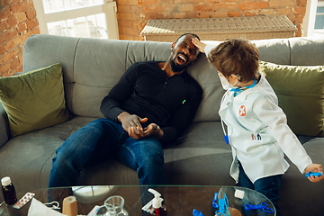 Image showing Little caucasian boy as a doctor consulting for patient, working in cabinet, close up