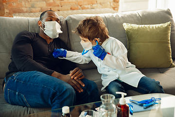 Image showing Little caucasian boy as a doctor consulting for patient, working in cabinet, close up