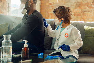 Image showing Little caucasian boy as a doctor consulting for patient, working in cabinet, close up