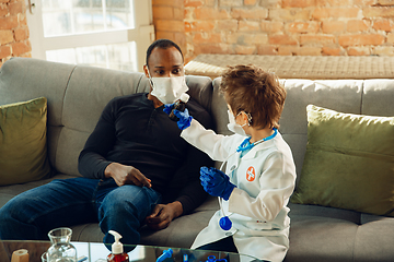 Image showing Little caucasian boy as a doctor consulting for patient, working in cabinet, close up