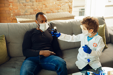 Image showing Little caucasian boy as a doctor consulting for patient, working in cabinet, close up