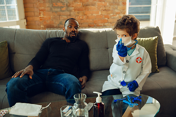 Image showing Little caucasian boy as a doctor consulting for patient, working in cabinet, close up