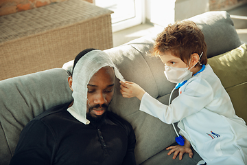 Image showing Little caucasian boy as a doctor consulting for patient, working in cabinet, close up