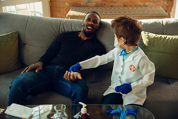 Image showing Little caucasian boy as a doctor consulting for patient, working in cabinet, close up