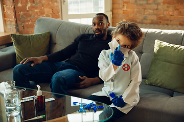 Image showing Little caucasian boy as a doctor consulting for patient, working in cabinet, close up