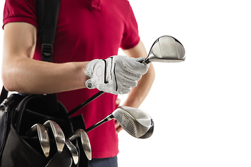 Image showing Golf player in a red shirt training, practicing isolated on white studio background