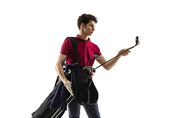 Image showing Golf player in a red shirt training, practicing isolated on white studio background