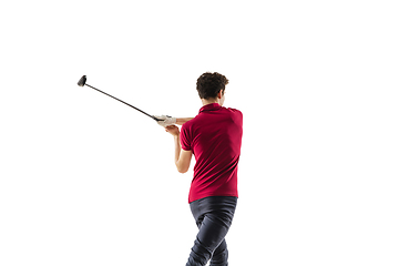 Image showing Golf player in a red shirt taking a swing isolated on white studio background