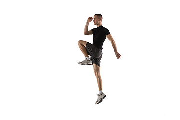 Image showing Young caucasian male model in action, motion isolated on white background. Concept of sport, movement, energy and dynamic, healthy lifestyle. Training, practicing.