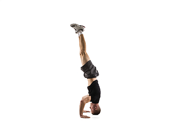 Image showing Young caucasian male model in action, motion isolated on white background. Concept of sport, movement, energy and dynamic, healthy lifestyle. Training, practicing.