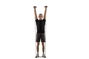 Image showing Young caucasian male model in action, motion isolated on white background. Concept of sport, movement, energy and dynamic, healthy lifestyle. Training, practicing.