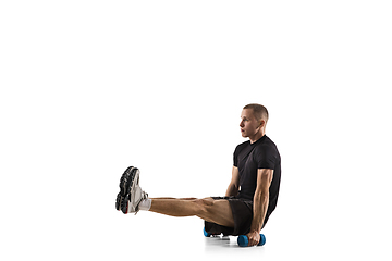 Image showing Young caucasian male model in action, motion isolated on white background. Concept of sport, movement, energy and dynamic, healthy lifestyle. Training, practicing.