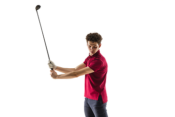 Image showing Golf player in a red shirt taking a swing isolated on white studio background