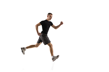 Image showing Young caucasian male model in action, motion isolated on white background. Concept of sport, movement, energy and dynamic, healthy lifestyle. Training, practicing.