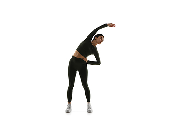 Image showing Young caucasian female model in action, motion isolated on white background. Concept of sport, movement, energy and dynamic, healthy lifestyle. Training, practicing.