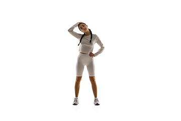 Image showing Young caucasian female model in action, motion isolated on white background. Concept of sport, movement, energy and dynamic, healthy lifestyle. Training, practicing.