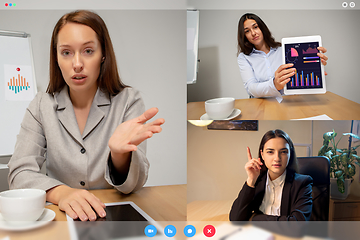 Image showing Young women talking, working in videoconference with co-workers at office or living room. Online business, education during quarantine.