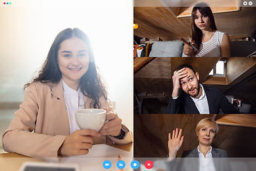 Image showing Young colleagues talking, working in videoconference with co-workers at office or living room. Online business, education during quarantine.