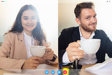 Image showing Young colleaugues talking, working in videoconference with co-workers at office or living room. Online business, education during quarantine.