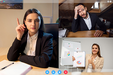 Image showing Young colleagues talking, working in videoconference with co-workers at office or living room. Online business, education during quarantine.