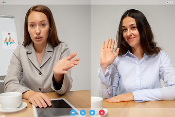 Image showing Young women talking, working in videoconference with co-workers at office or living room. Online business, education during quarantine.