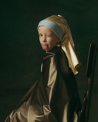 Image showing Medieval little girl as a lady with a pearl earring on dark studio background. Concept of comparison of eras, childhood. Stylish creative design, art vision, new look of artwork.