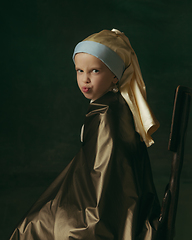 Image showing Medieval little girl as a lady with a pearl earring on dark studio background. Concept of comparison of eras, childhood. Stylish creative design, art vision, new look of artwork.