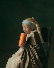 Image showing Medieval little girl as a lady with a pearl earring on dark studio background. Concept of comparison of eras, childhood. Stylish creative design, art vision, new look of artwork.