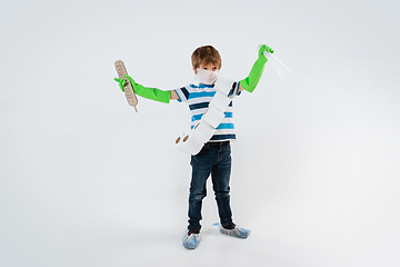 Image showing Little caucasian boy as a warrior in fight with coronavirus pandemic, with a face mask, a thermometer, sanitizer and a toilet paper bandoleer