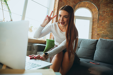 Image showing Caucasian woman singing during online concert at home isolated and quarantined, tuning streaming