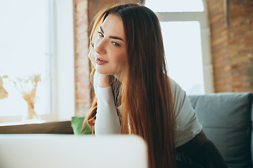 Image showing Caucasian woman singing during online concert at home isolated and quarantined, impressive improvising, close up